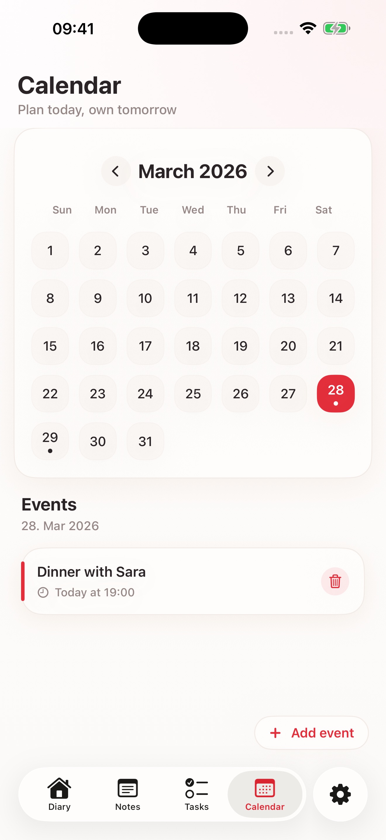 Calendar screen with a month view and an event listed below.